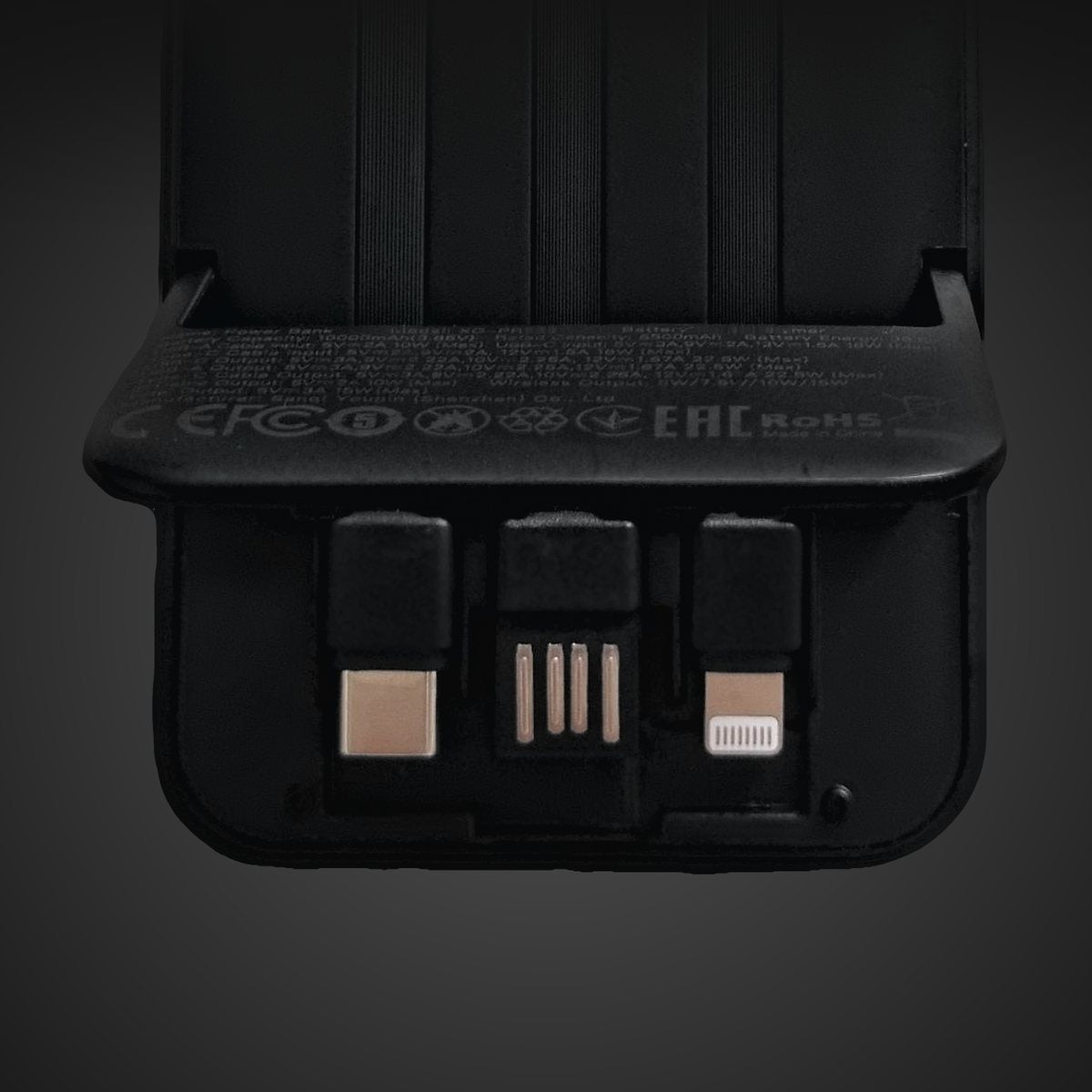 The USB-C, USB-A and Lightning connectors folded into the back of the power bank.