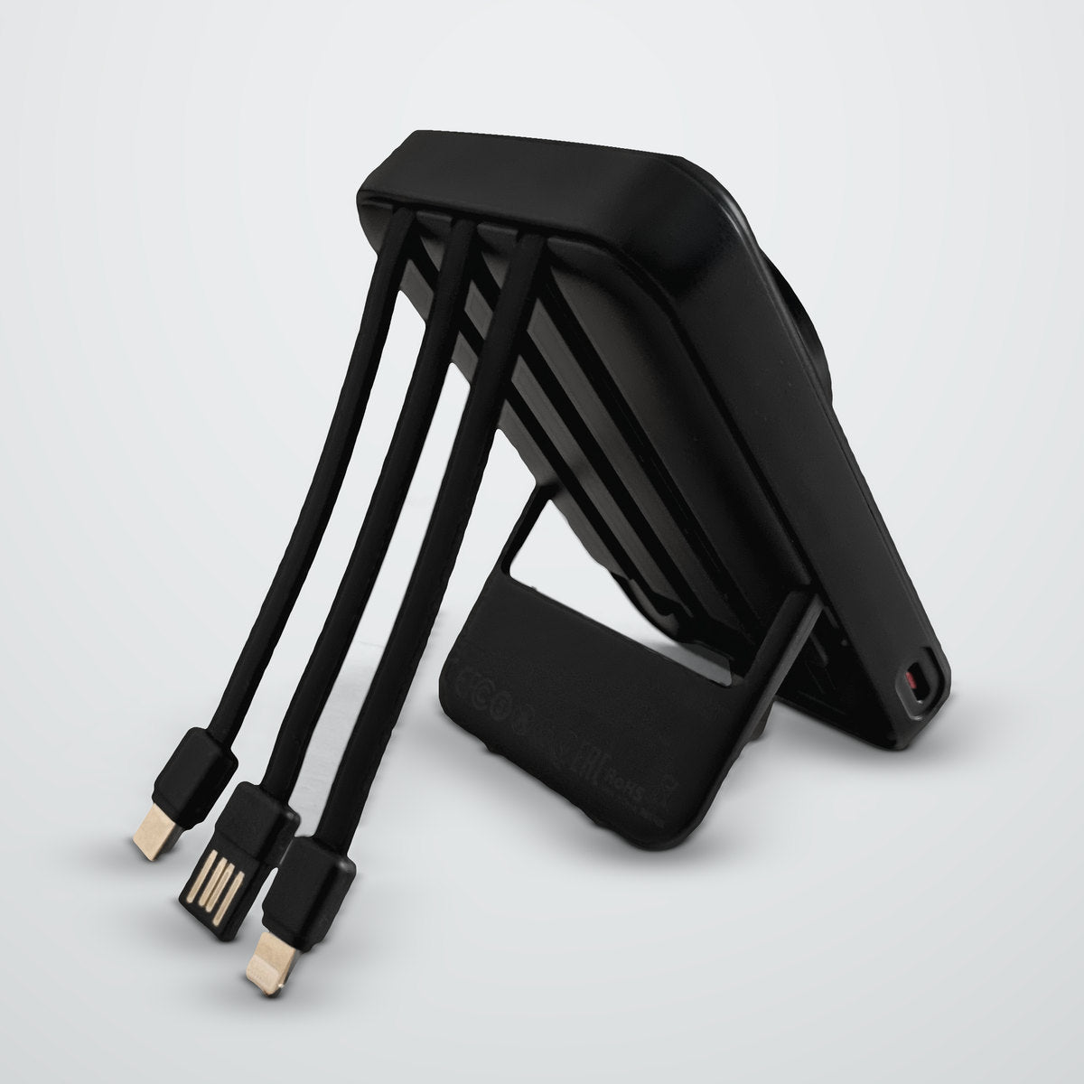 The SnapReserve 10K power bank on its fold-out stand, with its three built-in cables pulled out.